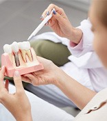 Woman listening to dentist during consultation 