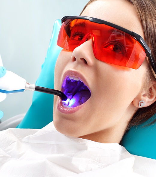 Patient receiving dental sealants