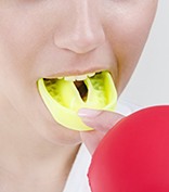 person wearing a yellow mouthguard 