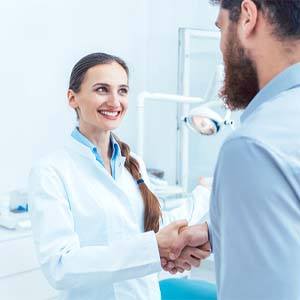 Man shaking hands with his dentist