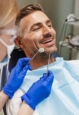 Man in dental chair about to undergo exam