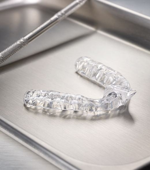 Clear nightguard for bruxism on metal tray