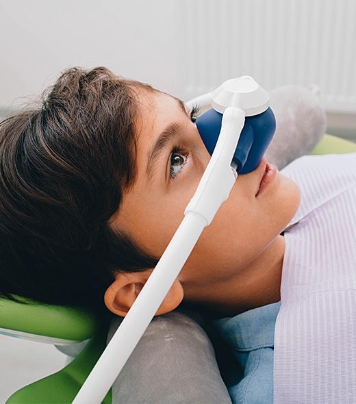 Young boy with nitrous oxide dental sedation mask