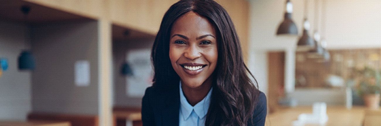 Businesswoman smiling with dental veneers in Lubbock