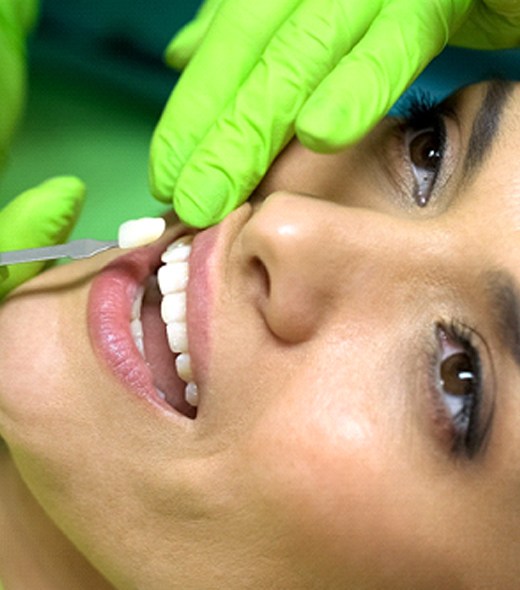 Woman having veneers placed by a cosmetic dentist in Lubbock