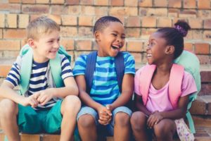 School children laughing after visiting Lubbock children's dentist 