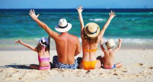 family enjoying their vacation at the beach