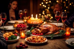 A table set with Thanksgiving dinner with people blurry in the background