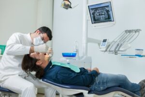 Dentist doing checkup on patient. 
